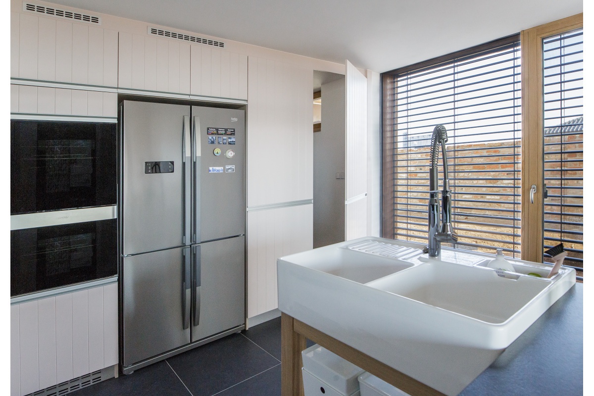 Family house interior - A free-standing sink on a solid oak table.