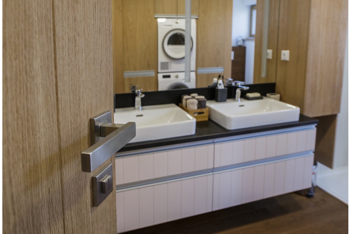 Family house interior - WC’s doesn’t necessarily have to be tiled – the owners opted for wood in this case as well.