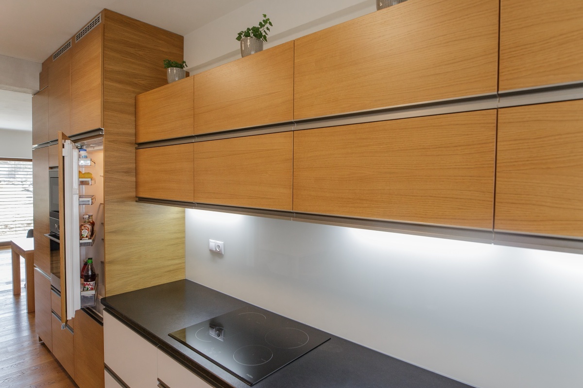Family house interior - It’s equipped with practical drawers, with quality Blum ironwork. The corner cabinets have a wire system which makes it easy to reach even the storage space behind the corner.
