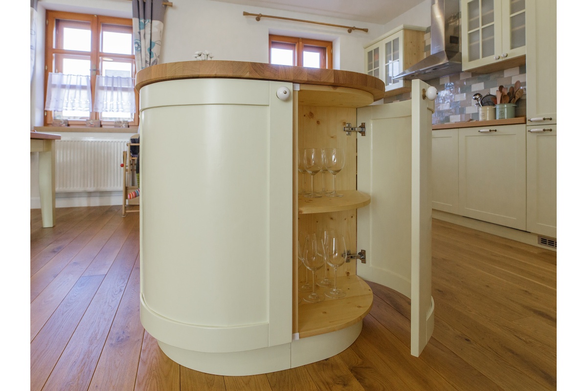 Family house interior - A larch table, capable of comfortably seating ten people, is the dining room’s dominant feature. The table top has a wax oil surface finish.