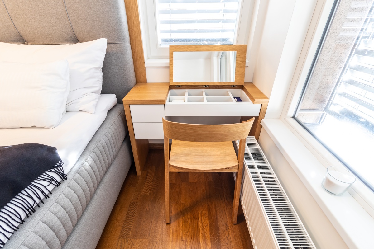 Interior of Apartment in New Building - In the clever storage space arrangement, we also installed a dressing table with fold-up top in the bedroom.